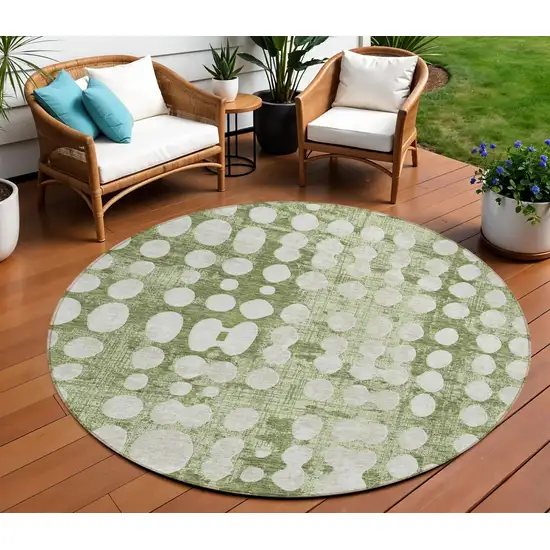 8' Artichoke Green And Ivory Round Abstract Washable Indoor Outdoor Area Rug Photo 1