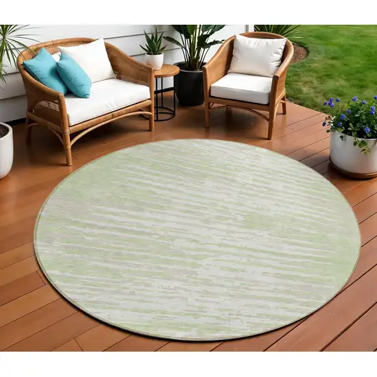 8' Artichoke Green And Ivory Round Striped Washable Indoor Outdoor Area Rug Photo 1