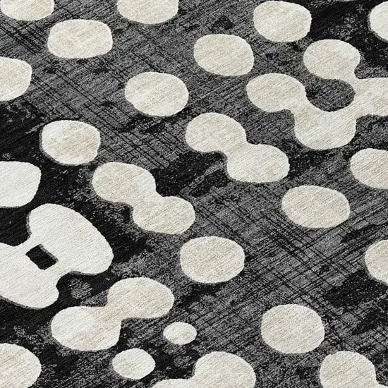 8' Black And Ivory Round Abstract Washable Indoor Outdoor Area Rug Photo 8