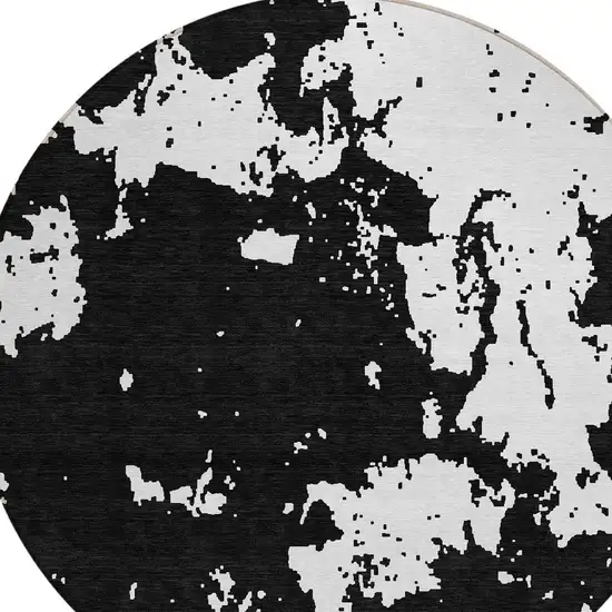 8' Black And Ivory Round Abstract Washable Indoor Outdoor Area Rug Photo 5