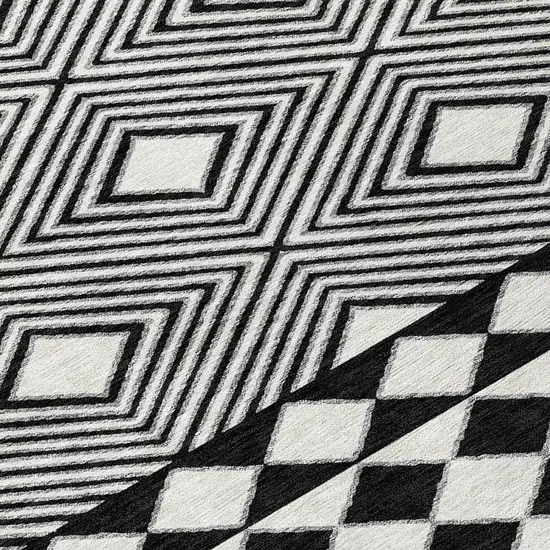 8' Black And Ivory Round Geometric Washable Indoor Outdoor Area Rug Photo 8