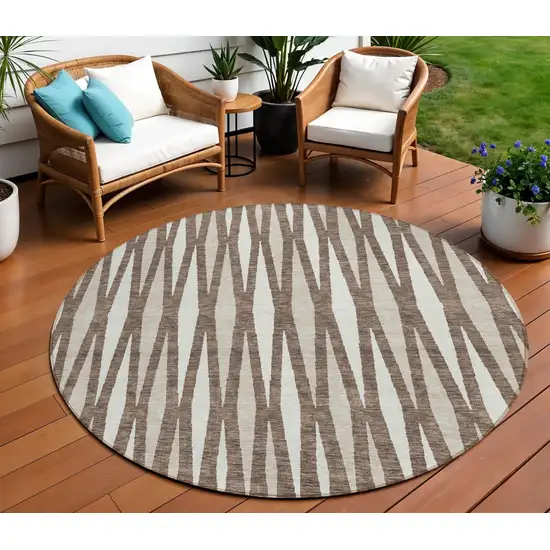 8' Brown And Ivory Round Geometric Washable Indoor Outdoor Area Rug Photo 1