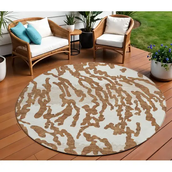8' Brown Beige And Ivory Round Animal Print Washable Indoor Outdoor Area Rug Photo 1