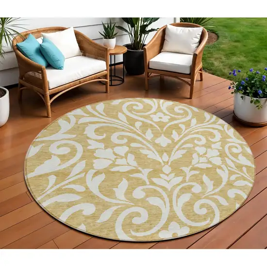8' Gold And Beige Round Floral Washable Indoor Outdoor Area Rug Photo 1