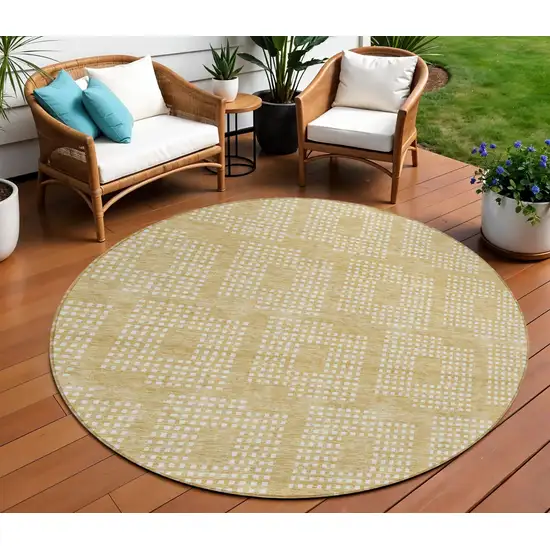 8' Gold And Ivory Round Geometric Washable Indoor Outdoor Area Rug Photo 1