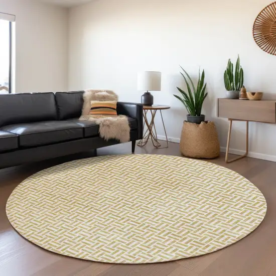 8' Gold And Ivory Round Geometric Washable Indoor Outdoor Area Rug Photo 8