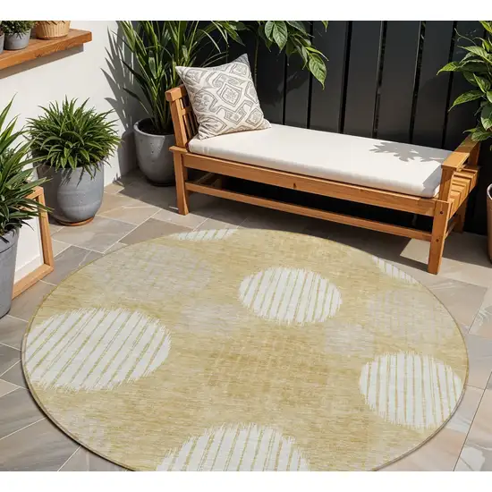 8' Gold Gray And Ivory Round Geometric Washable Indoor Outdoor Area Rug Photo 1