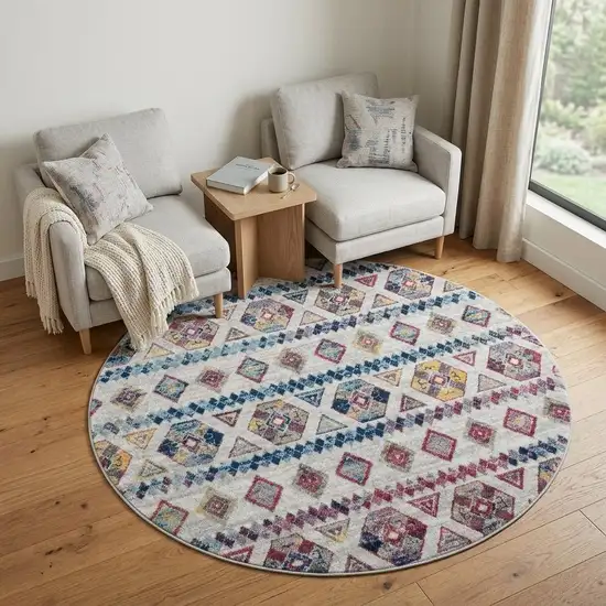 6' Ivory Blue and Orange Geometric Power Loom Round Rug Photo 1