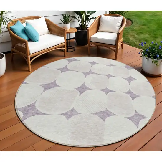 8' Lavender Beige And Ivory Round Abstract Washable Indoor Outdoor Area Rug Photo 1