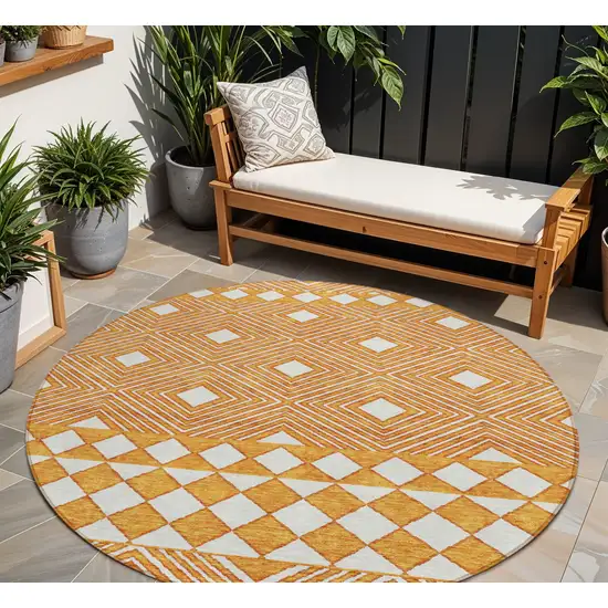 8' Orange And Ivory Round Geometric Washable Indoor Outdoor Area Rug Photo 1