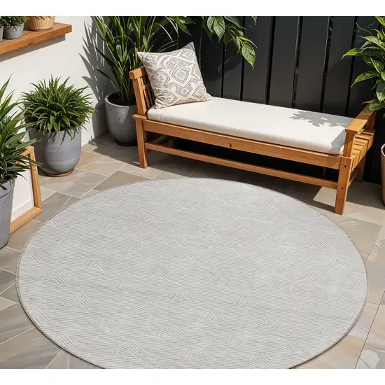 8' Taupe And Ivory Round Geometric Washable Indoor Outdoor Area Rug Photo 1