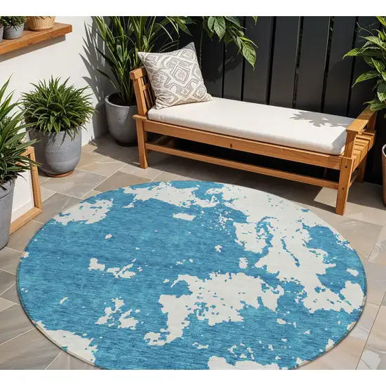 8' Teal Blue And Ivory Round Abstract Washable Indoor Outdoor Area Rug Photo 1