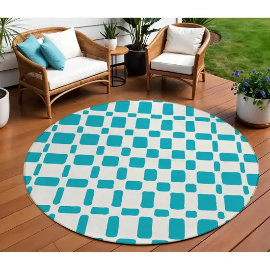 8' Teal Blue And Ivory Round Geometric Washable Indoor Outdoor Area Rug Photo 1