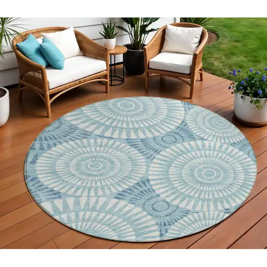 8' Teal Blue And Ivory Round Geometric Washable Indoor Outdoor Area Rug Photo 1