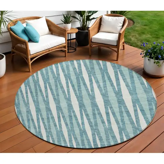 8' Teal Blue And Ivory Round Geometric Washable Indoor Outdoor Area Rug Photo 1
