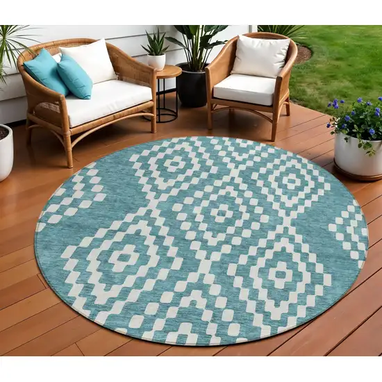 8' Teal Blue And Ivory Round Geometric Washable Indoor Outdoor Area Rug Photo 1