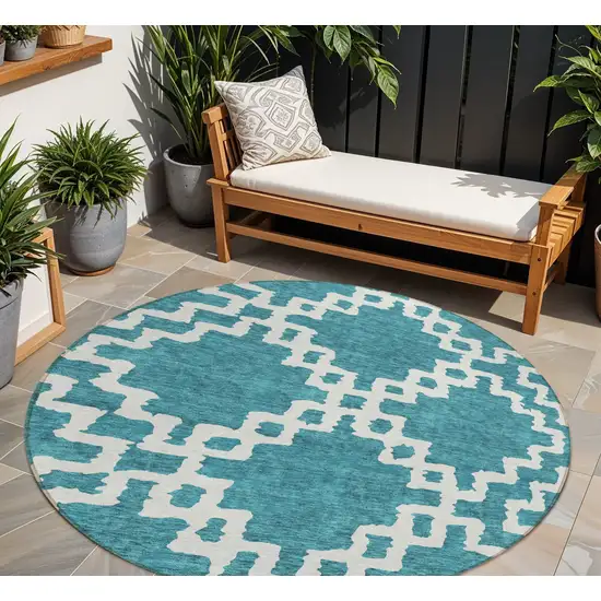 8' Teal Blue And Ivory Round Geometric Washable Indoor Outdoor Area Rug Photo 1