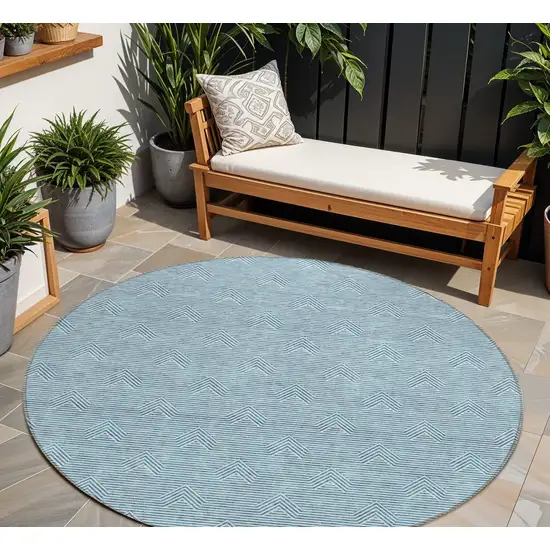 8' Teal Blue And Ivory Round Geometric Washable Indoor Outdoor Area Rug Photo 1