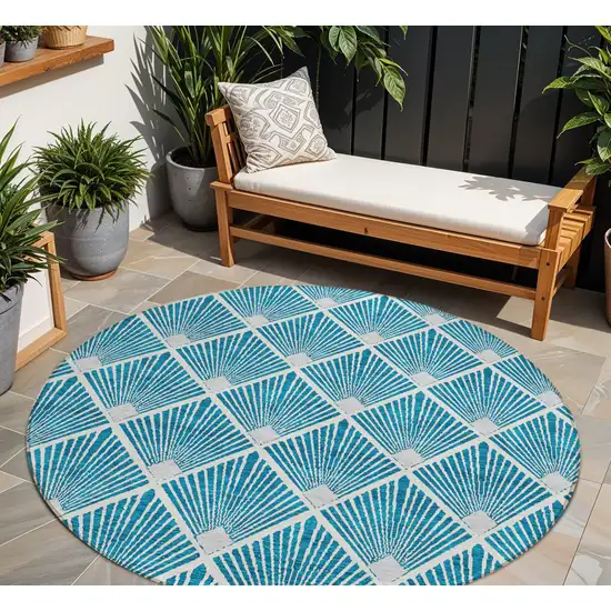 8' Teal Blue And Ivory Round Geometric Washable Indoor Outdoor Area Rug Photo 1