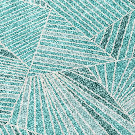 8' Teal Blue And Ivory Round Geometric Washable Indoor Outdoor Area Rug Photo 4