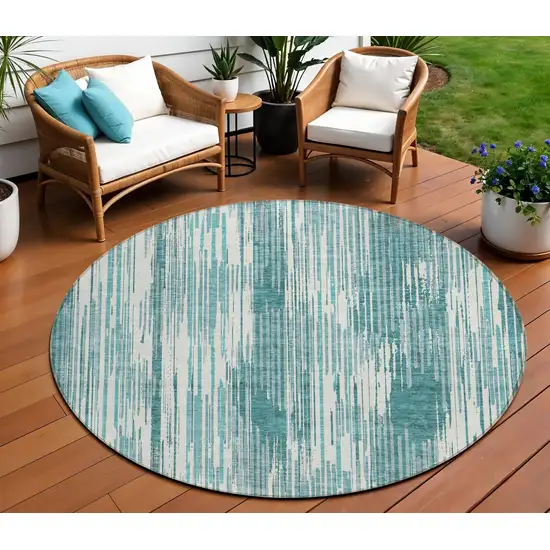 8' Teal Blue And Ivory Round Striped Washable Indoor Outdoor Area Rug Photo 1