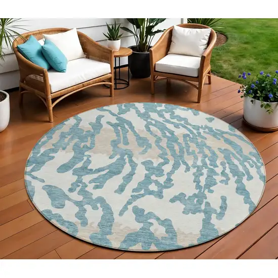 8' Teal Blue Beige And Ivory Round Animal Print Washable Indoor Outdoor Area Rug Photo 1