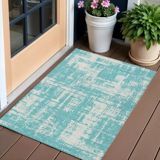 Aqua And Ivory Abstract Washable Indoor Outdoor Area Rug Photo 1