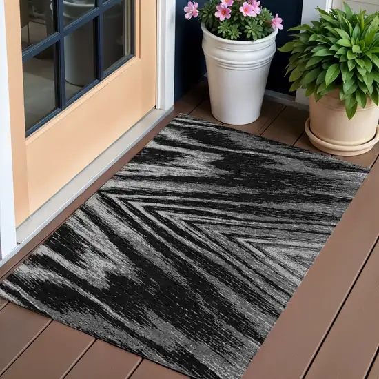 Black And Gray Abstract Washable Indoor Outdoor Area Rug Photo 1
