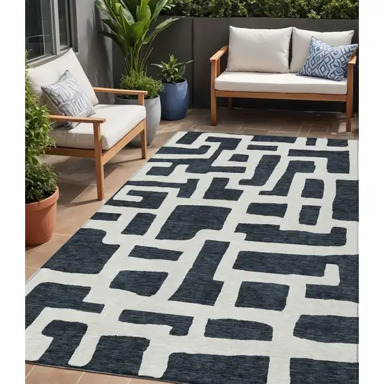 Black And Ivory Abstract Washable Indoor Outdoor Area Rug Photo 1