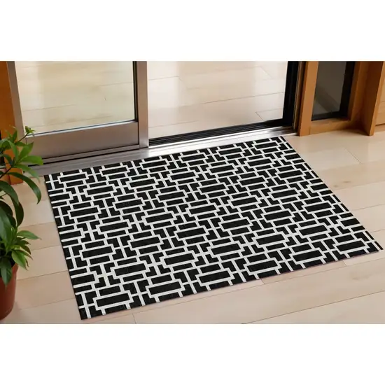 Black And Ivory Geometric Washable Indoor Outdoor Area Rug Photo 1
