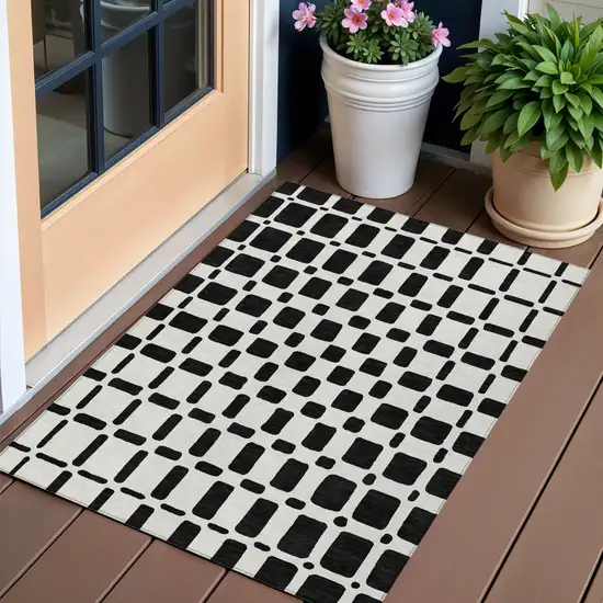 Black And Ivory Geometric Washable Indoor Outdoor Area Rug Photo 1