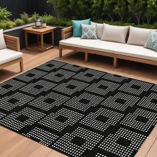 Black And Ivory Geometric Washable Indoor Outdoor Area Rug Photo 1