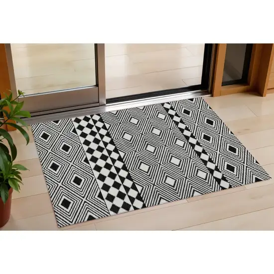 Black And Ivory Geometric Washable Indoor Outdoor Area Rug Photo 1