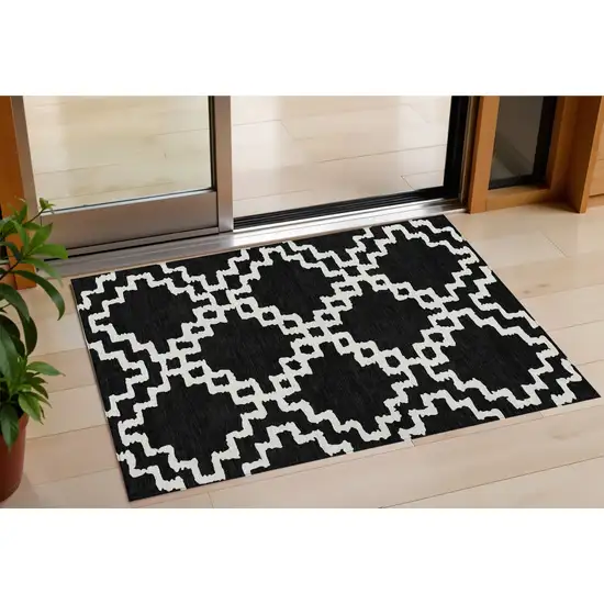 Black And Ivory Geometric Washable Indoor Outdoor Area Rug Photo 1
