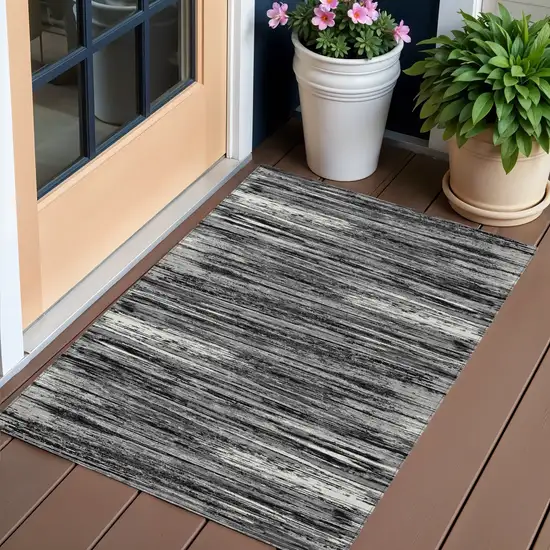 Black And Ivory Striped Washable Indoor Outdoor Area Rug Photo 1