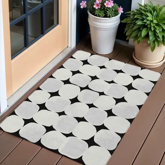 Black Gray And Ivory Abstract Washable Indoor Outdoor Area Rug Photo 1