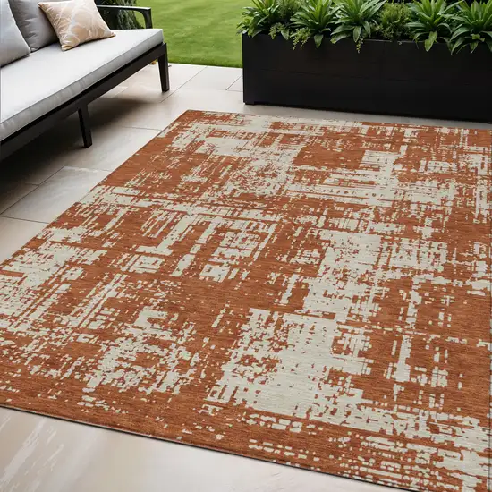 Brown And Ivory Abstract Washable Indoor Outdoor Area Rug Photo 1