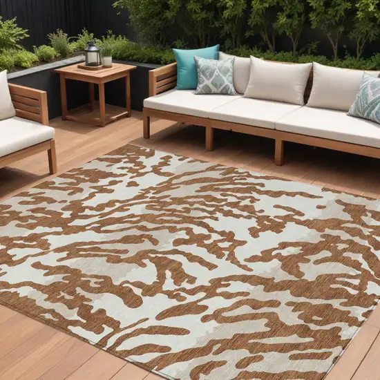 Brown Beige And Ivory Animal Print Washable Indoor Outdoor Area Rug Photo 1