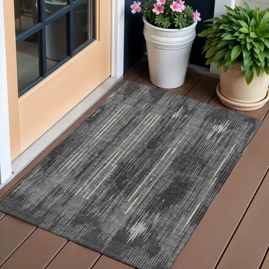Charcoal Gray And Ivory Striped Washable Indoor Outdoor Area Rug Photo 1