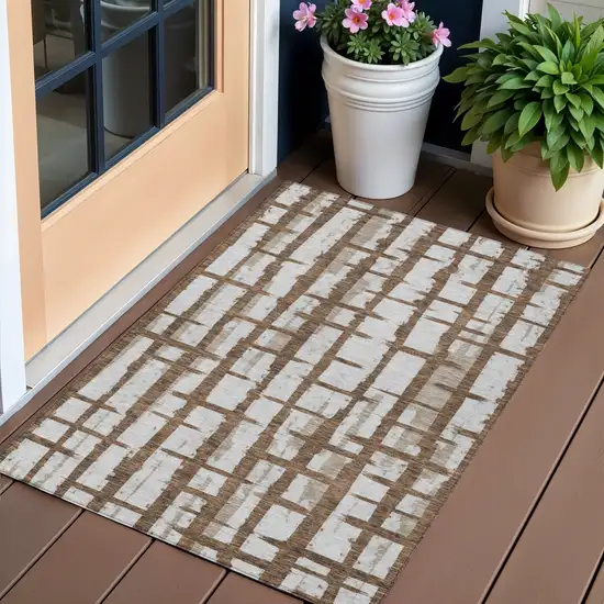 Chocolate And Beige Striped Washable Indoor Outdoor Area Rug Photo 1