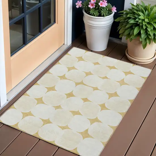 Gold And Beige Abstract Washable Indoor Outdoor Area Rug Photo 1