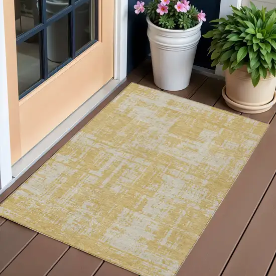Gold And Gray Abstract Washable Indoor Outdoor Area Rug Photo 1