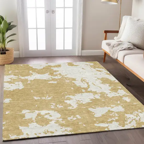 Gold And Ivory Abstract Washable Indoor Outdoor Area Rug Photo 9