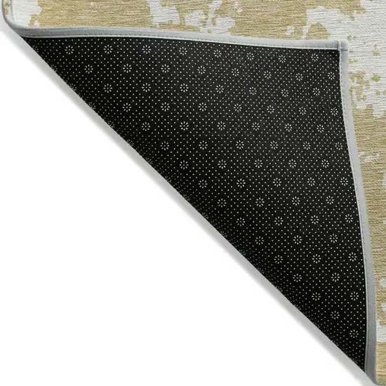 Gold And Ivory Abstract Washable Indoor Outdoor Area Rug Photo 4