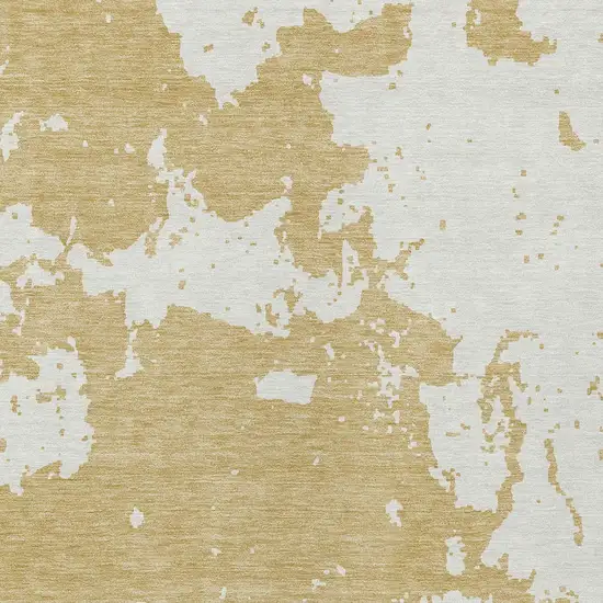 Gold And Ivory Abstract Washable Indoor Outdoor Area Rug Photo 6