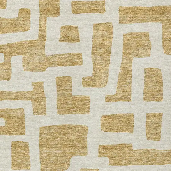 Gold And Ivory Abstract Washable Indoor Outdoor Area Rug Photo 6