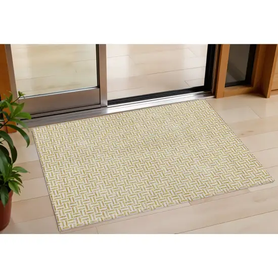 Gold And Ivory Geometric Washable Indoor Outdoor Area Rug Photo 1