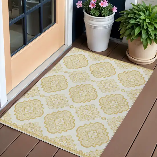 Gold And Ivory Medallion Washable Indoor Outdoor Area Rug Photo 1