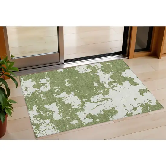 Green And Ivory Abstract Washable Indoor Outdoor Area Rug Photo 1