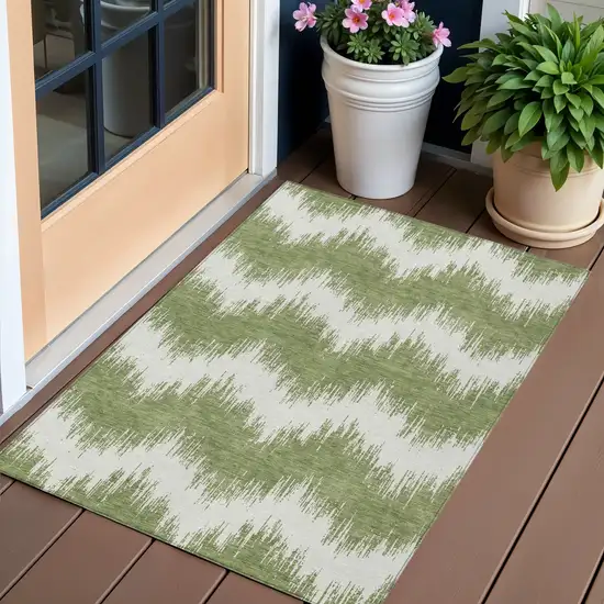 Green And Ivory Chevron Washable Indoor Outdoor Area Rug Photo 1